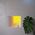 Gray Cubic Wall Lamp With Warm Yellow Light And Green Plant Leaves On Dark Background
