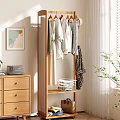 Modern Minimalist Room With Wooden Clothes Rack Hanging Clothes Storage Basket And Plant