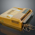 Vintage Yellow Fax Machine From 1984 With Worn Appearance And Tangled Cable