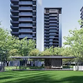 Modern Residential Landscape With High Rise Buildings Lush Green Trees And Green Lawn
