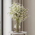 Stylish Geometric Glass Vase With White Small Flowers By Window With Curtains And Natural Light