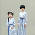 Traditional Hanfu Dressed Woman With Children In Blue Embroidered Outfits