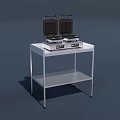 Two Black Waffle Makers As Kitchen Appliances On Metal Table 3d model