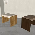Two Minimalist Wooden Stools With Soft Upholstered Seats In Light And Dark Wood Tones