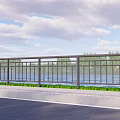 Modern Metal Railing Along Waterfront Road With Green Trees And Clear Sky