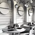 Modern Restaurant Interior With Circular Mirrors Pendant Lights Booth Seating And Round Dining Tables