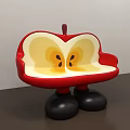 Apple Shaped Public Chair With Red Exterior Yellow Interior And Black Legs