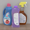 Household Laundry Cleaning Supplies With Blue Purple Brown Detergent And Spray Bottles