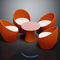 Rattan Table and Chair Set with Orange Chairs White Cushions Round Pink Tapered Leg Table