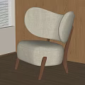 Modern Beige Fabric Accent Chair with Curved Backrest and Wooden Legs in Home Interior