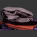 Stacked Colorful Textured Towels In Various Hues Purple Red And Blue