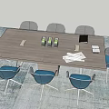 Modern Rectangular Conference Table With Blue Cushioned Chairs And Water Bottles Documents In Office