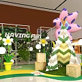 Shopping Mall Interior With Large Colorful Flowers Green Plant Decorations And NAYZEER COM Sign
