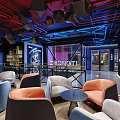 Fitness Center Lounge With Modern Industrial Design Blue Red Pipes Grid Ceiling And Comfortable Sofas