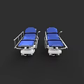Hospital Ward Setting With Two Blue Mattress Wheeled Beds And Medical Features