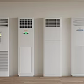 White Standing Air Conditioners Arranged Against Wall In Indoor Setting