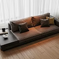 Brown Two Seater Sofa with Gray and Beige Cushions by White Curtains on Wooden Floor