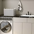 White Storage Basket In Modern Laundry Room With Washing Machine Sink And Cabinets