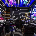 Modern KTV Interior Design With Neon Lights Luxury Sofas Large Screen And Decorations