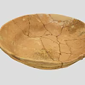 Earth Toned Ceramic Bowl With Visible Cracked Patterns And Vintage Handcrafted Design