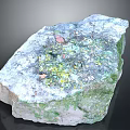 Raw Natural Stone With Green White Yellow Surface And Colorful Specks