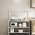 Wooden Kitchen Cabinets Featuring Metal Shelf Microwave Cooking Utensils And Storage Boxes
