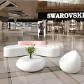 Swarovski Mall Store Modern Interior With White Pink Seating And Green Plant Decor