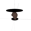 Modern Round Black Dining Table With Unique Twisted Base On Light Wooden Floor And Shadows