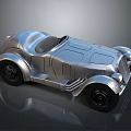 Silver Metallic Vintage Convertible Car With Streamlined Body And Black Wheels