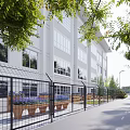 White Building Exterior With Large Windows Green Trees Flower Beds Wooden Benches And Path