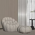 Plush Beige Modern Lounge Chair With Footstool And Green Plant In Neutral Interior