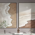 Two Beige Brown Wave Decorative Paintings With Green Plant Sculpture Ornament On Light Wall