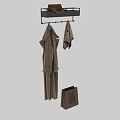 Beige Soft Bathrobe Hanging On Black Rack With Striped Towel And Paper Shopping Bag