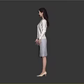 A Woman Standing In Gray Background Wearing White Cardigan And Lace Skirt With High Heels