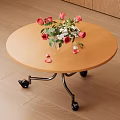 Round Wooden Tea Table With Metal Frame Wheels And Vase Red Roses Petals