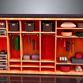 Organized Wooden Closet Interior With Hanging Clothes Storage Boxes And Folded Towels