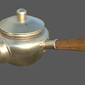 Vintage Silver Teapot With Wooden Handle And Shiny Metallic Body