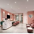 Shopping Mall Nail Salon With Pink Walls Marble Counter Comfortable Pink Chairs And Decorative Paintings