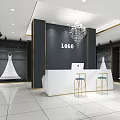 Modern Bridal Shop Interior With Hanging Wedding Dresses White Reception Counter And Chandelier