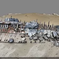 Abandoned Rusted Metal Construction Components With Scattered Stones And Sandy Soil