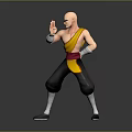 Bald Man in Yellow Top Black Pants Red Belt Striking Martial Arts Pose Gray Background