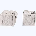 Woven Rattan Storage Baskets With Grey Cloth And Books Inside