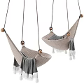 Beige Knitted Hanging Chair With Wooden Accents And Gray Fringed Blanket