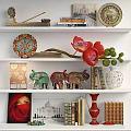 Stylish Decorative Ornament Set With Elephant Figurines Decorative Plates Vases Books And Orchid On Shelves