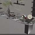 Modern Marble Coffee Table with Black Metal Legs and Decorative Items Like Vase Plant Magazine