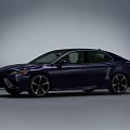 Sleek Blue Sedan Featuring Sporty Alloy Wheels And Aerodynamic Body Design