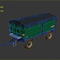 Green Agricultural Trailer With Grey Canopy Top And Yellow Side Signs