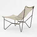 Beige Leather Leisure Chair With Curved Design And Black Metal Frame
