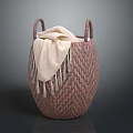 Brown Woven Basket With Two Handles Holding Beige Blanket On Gray Background