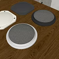 Modern Audio Speakers In White Black And Gray On Wooden Table With Mesh Design